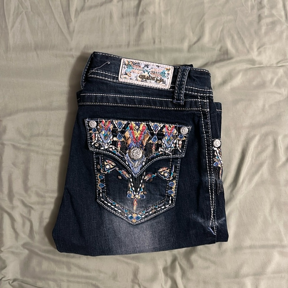 Grace in LA
Colorful, dark blue wash, boot cut jeans